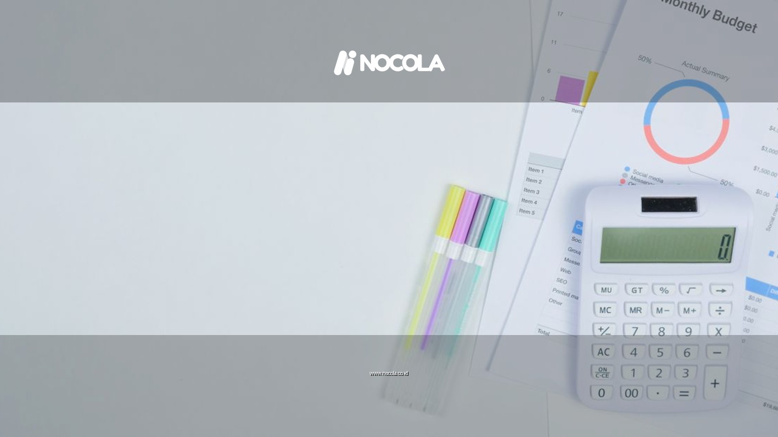 Minimalist office desk with a calculator, budget planning documents, and colorful pens.