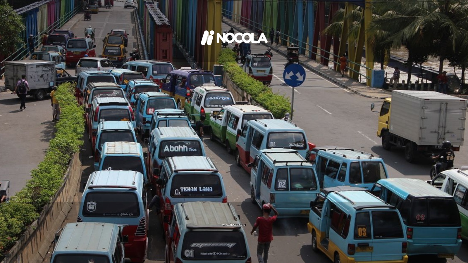 Traffic congestion on a vibrant bridge in Tangerang, Indonesia, showcasing urban life.