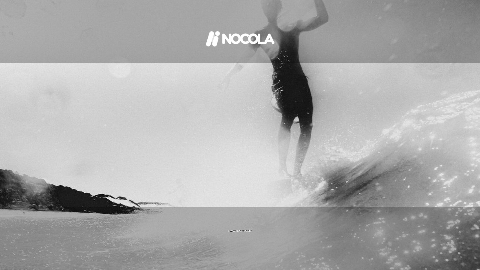 A dynamic black and white shot of a surfer riding a wave near Pipa, Brazil.