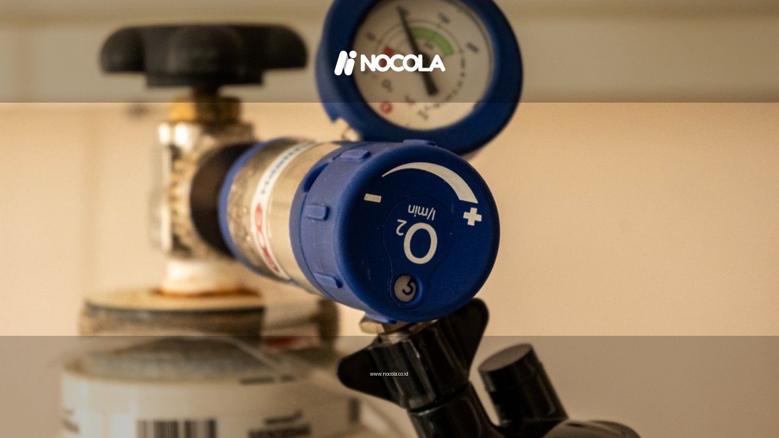 Detailed view of an oxygen tank with a pressure gauge, showcasing medical equipment usage.