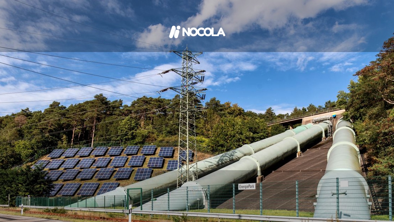 Solar panels and industrial pipes in Geesthacht's EnergiePark on a sunny day.