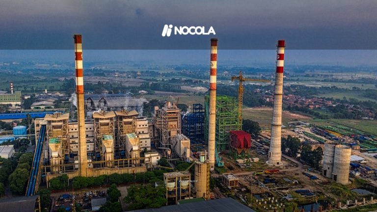 Aerial view of an industrial plant with smokestacks in Serang, Banten, Indonesia during daylight.