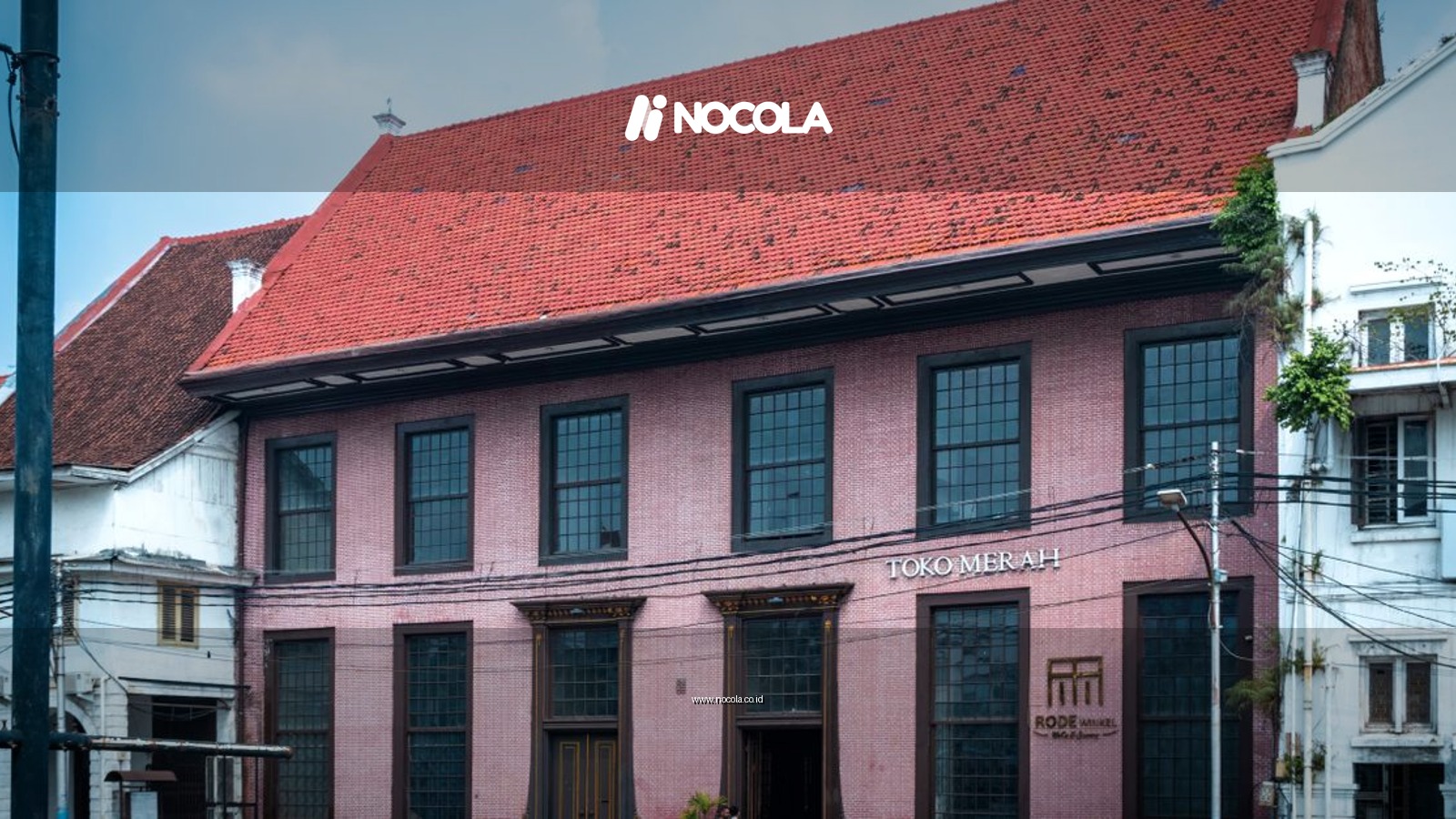 Red-roofed Toko Merah, a historic landmark in Jakarta, Indonesia, captured on a clear day.