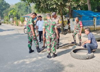 Pendekatan Sinergitas TNI-Polri Cegah Kecelakaan, Polsek Kotarih dan Koramil Pasang Pita Kejut Speed Bump