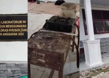 Tampak peralatan pekerja berserak di dalam ruang kelas yang digunakan sebagai base camp
