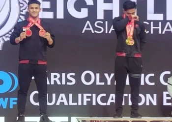 Rahmat Erwin Raih Tiga Emas Sekaligus Pertajam Rekor Dunia Angkat Besi