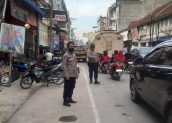 Polsek Perdagangan Amankan Pasar Tumpah Jelang Berbuka Puasa, Pastikan Situasi Aman dan Kondusif