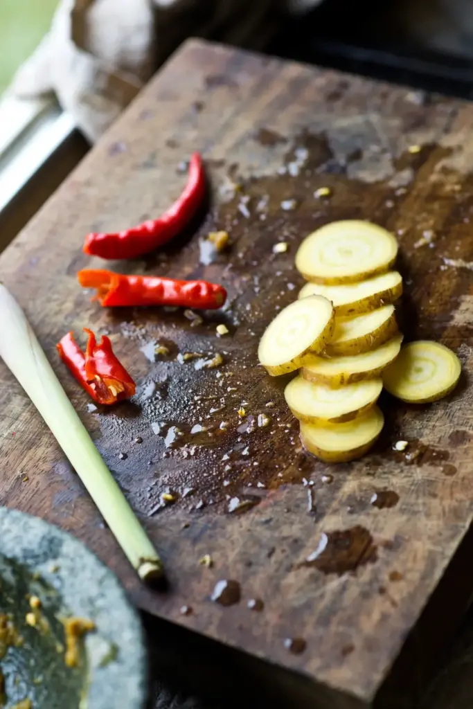 Sliced fingerroot with chilies and lemongrass for curry paste