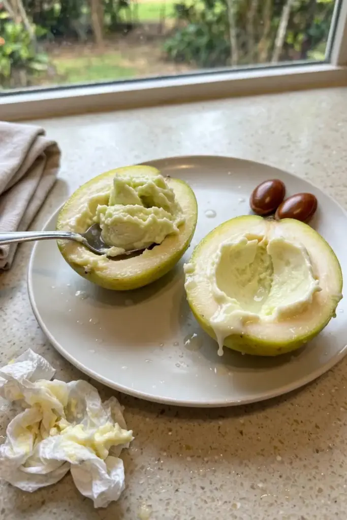 Sliced white sapote with creamy flesh served on a plate