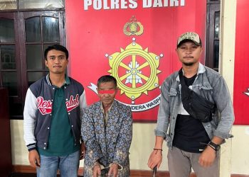 Tersangka MP saat diamankan Polisi Di Mapolres Dairi, Kamis (9/6)