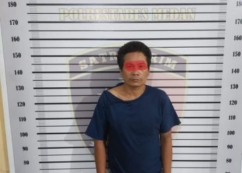 Tersangka pembobol Sekolah, Andre Firman Lase saat diamankan di Mapolsek Medan Timur, Rabu (5/10).