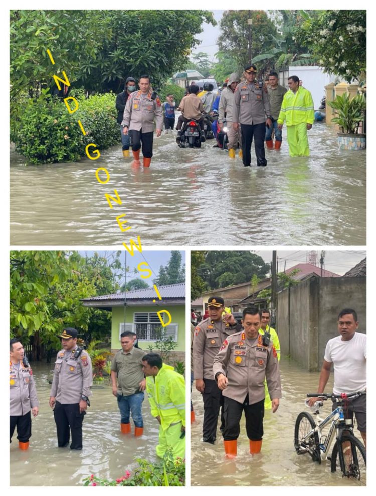 Kapolresta Deliserdang, Kombes. Pol. Irsan Sinuhaji SIK, SH saat tinjau banjir, Jumat pagi (9/12).