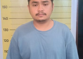 Diving Lumbantobing saat diamankan di Polres Taput, Jumat (17/2).