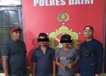 Tersangka OOH dan LS saat diamankan di Kapolres Dairi, Jumat (24/3).