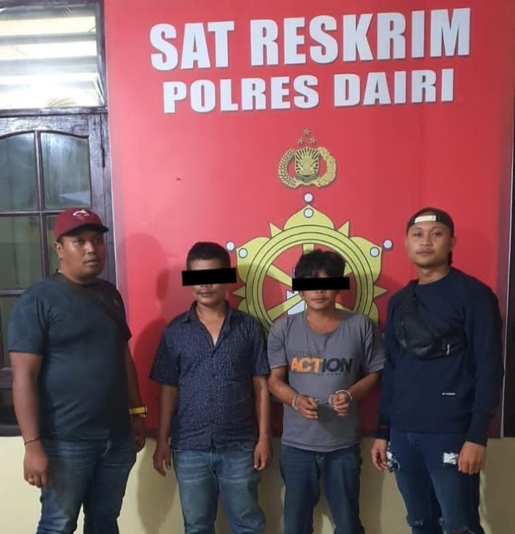 Tersangka OOH dan LS saat diamankan di Kapolres Dairi, Jumat (24/3).