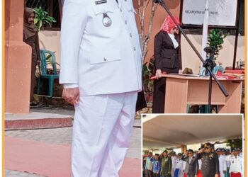 Camat Belitang III, HM. Nuh Hudawi saat bertindak sebagai ispektur upacara HUt