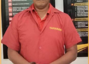 Indra Alamsyah, mantan Anggota DPRD Sumut saat diamankan di Polda Sumut, Senin (21/8).