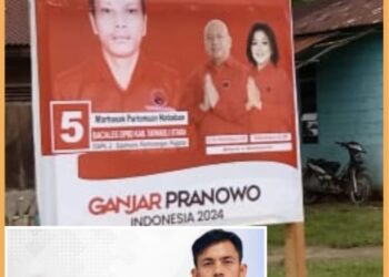 Rijon Manalu dan alat peraga kampanye Caleg PDIP Marhasak Nababan No 5 dapil II dari Partai PDIP, Selasa (7/11). 