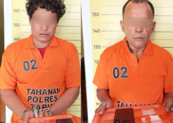 Arman Sitompul dan Malem Karina Ginting saat diamankan di Polres Taput, Minggu (14/1).