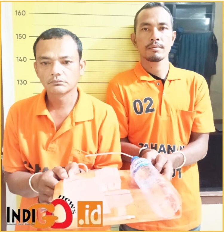Ricki Sihite bersama Dian Sahputra Nasution saat diamankan di Polres Taput, Senin (26/2).
