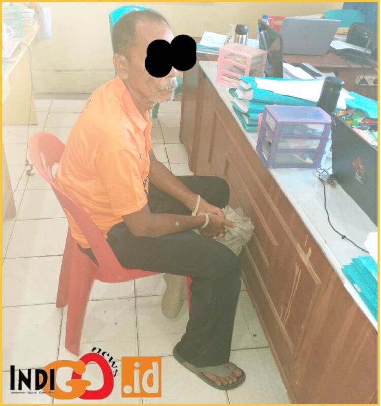 Tersangka BS saat diamankan di Polres Taput, Kamis (21/3).