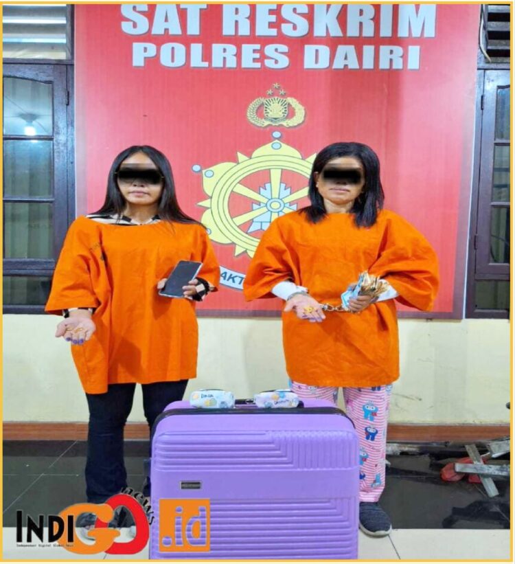 Tersangka DM dan MS saat diamankan di Mapolres Dairi, Sabtu (25/5).