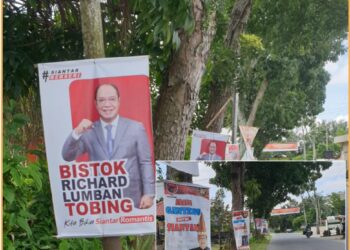 Poster Bistok dan Yan Santoso dijalan Pdt. J Wismar Saragih yang dipaku dipepohonan, Rabu (10/7).