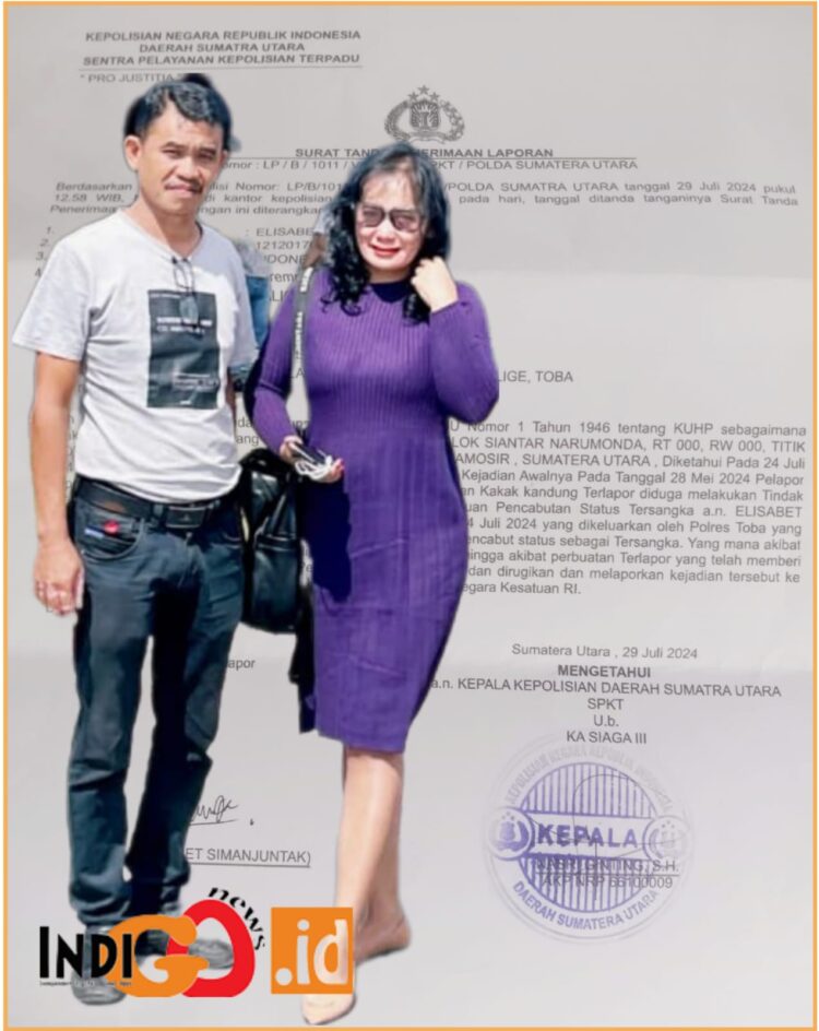 Elisabet Simanjuntak bersama suaminya saat di Mapolda Sumut, Senin (29/7).