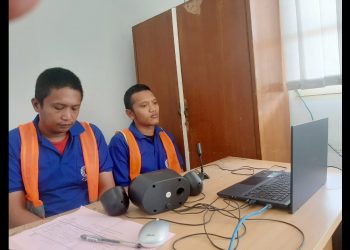 Kedua Terdakwa, Taufik Hidayat dan Rinaldi Syah Harahap alias Gurdak saat sidang virtual dari Lapas Kelas IIA Pematangsiantar