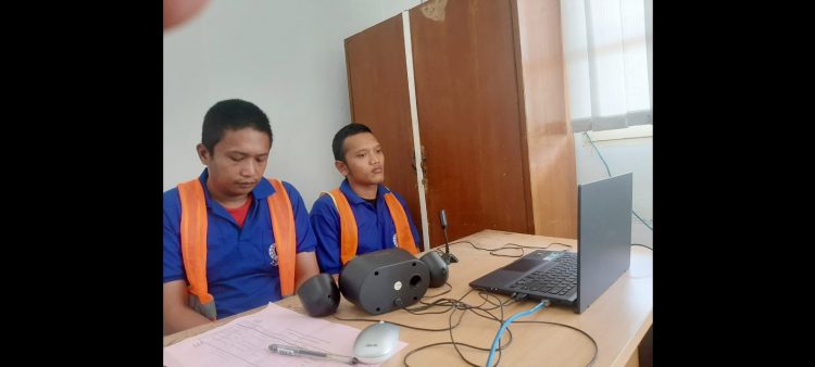 Kedua Terdakwa, Taufik Hidayat dan Rinaldi Syah Harahap alias Gurdak saat sidang virtual dari Lapas Kelas IIA Pematangsiantar