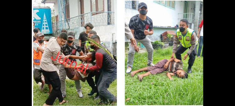 Kasat Reskrim AKP Banuara Manurung SH dan Kapolsek Siantar Selatan IPTU Edi Saragih saat menolong Robin Simbolon untuk dibawa ke RSUD dr Djasamen Saragih