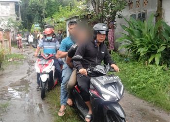 Pelaku Ranjit Alias Anjit saat diboyong Polisi mengendarai sepedamotor ke Mako Polres Tanjung Balai