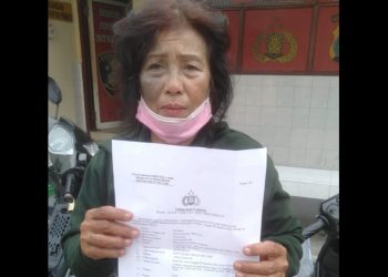 Rusnah usai membuat laporan di Polsek Percut Sei Tuan. (Foto/ist)
