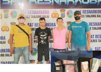 kedua pelaku, SL dan SN serta barang bukti diapit polisi