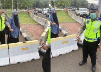 Wanita yang diamankan bersama pistol saat berusaha menerobos Istana Negara. (Foto Ist)