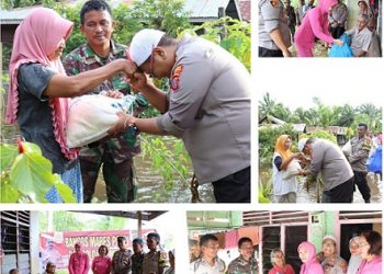 Kapolres Tanjungbalai AKBP Ahmad Yusuf Afandi SIK, MM bersama Ketua Bhayangkari Cabang Tanjungbalai Ny. Vera Yusuf Afandi menyalurkan bantuan sembako kepada warga terdampak banjir