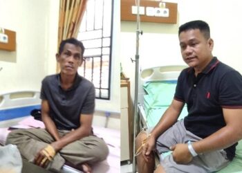 Kedua karyawan kebun korban penganiayaan saat menjalani perawatan di rumah sakit