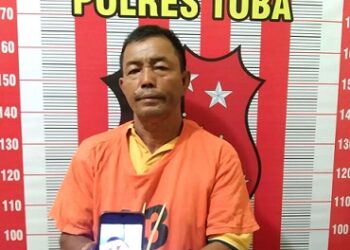 Lukman Dolok Saribu warga Desa Dolok Saribu, Kecamatan Uluan, Kabupaten Toba ditahan polisi. (Foto Ist)