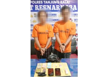 Pasangan suami isteri, J dan M alias S beserta barang bukti