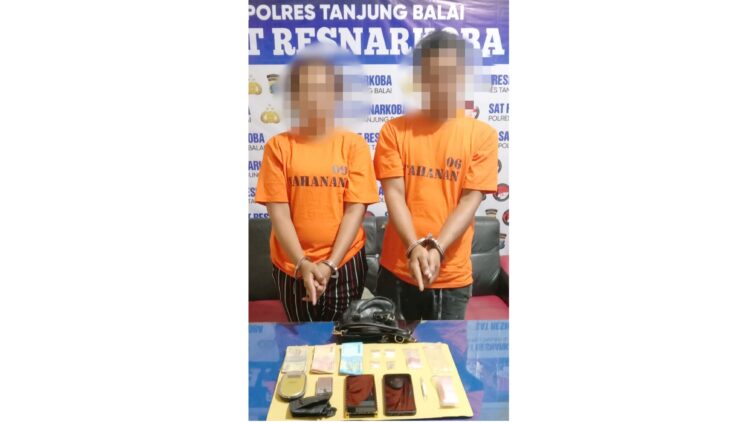 Pasangan suami isteri, J dan M alias S beserta barang bukti