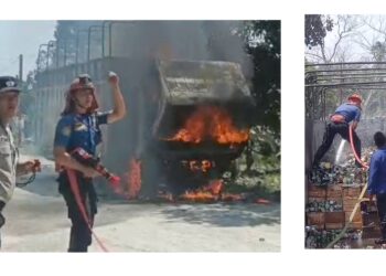 petugas Damkar Siantar saat padamka truk yang terbakar di TKP