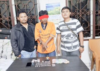 Tersangka Selamat Riadi dan barang bukti 