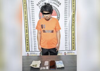Tersangka Riando Fransiskus Sijabat alias Ando dan barang bukti