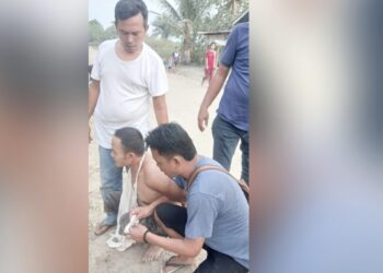 Tersangka W alias Nano saat ditangkap di TKP