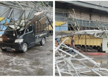 Kanovi Suzuya Mereka Mall yang roboh menimpa truk warna kuning BK 8935 NE dan mobil pick up Grand Max BK 8175 FG sedang parkir dibawahnya.