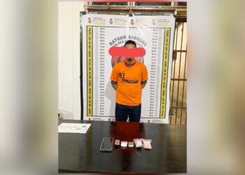 tersangka Rahdinal Muhdi alias Dinal dan barang bukti