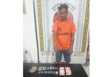 Tersangka Imanuel Boby Cristian Sinuhaji beserta barang bukti