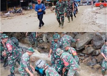 Terlihat personel Korem 022/PT, Kodim 0207 saat membantu normalisasi daerah yang terdampak banjir di Parapat. (mass)