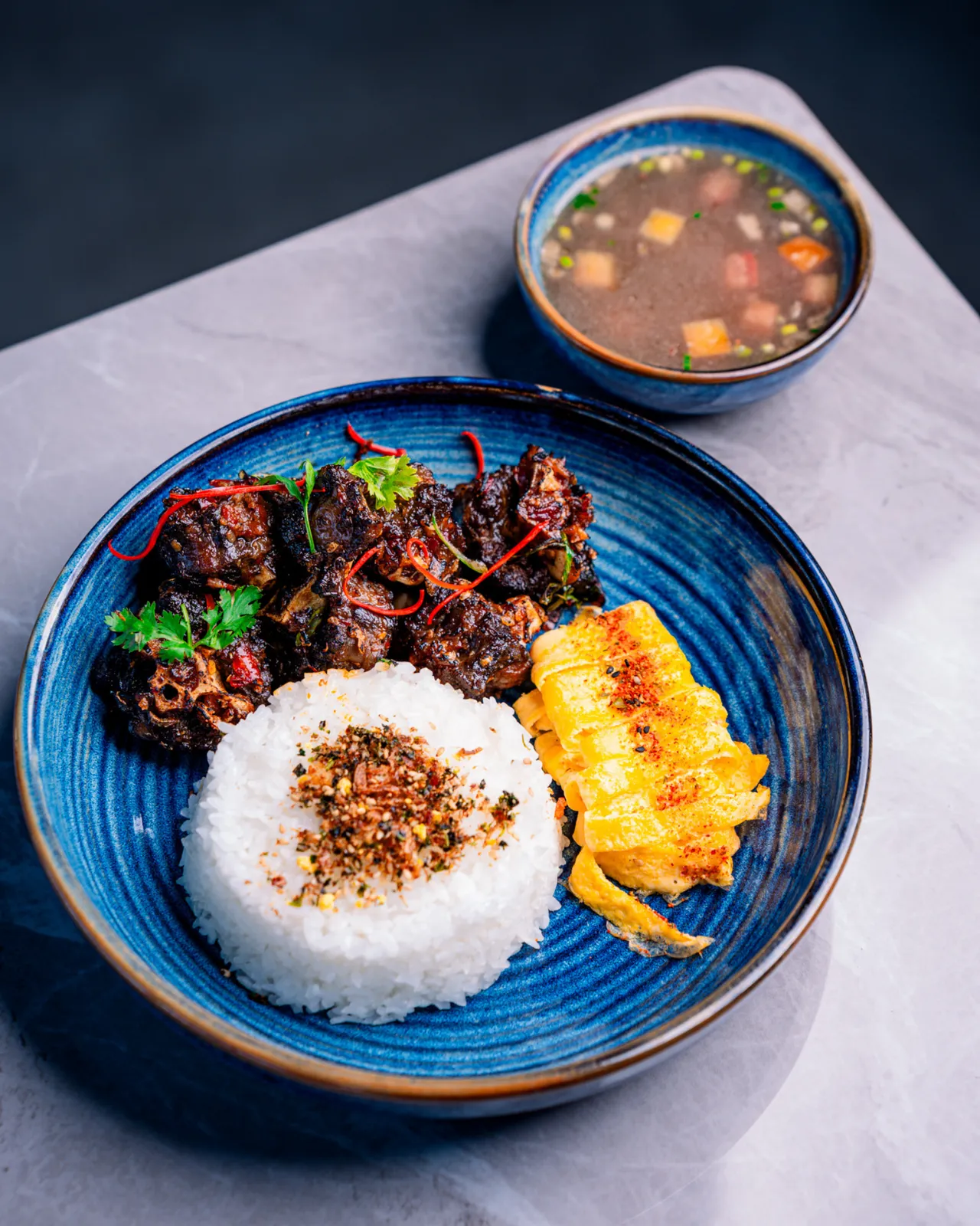 Grilled oxtail rica with rice and oxtail soup