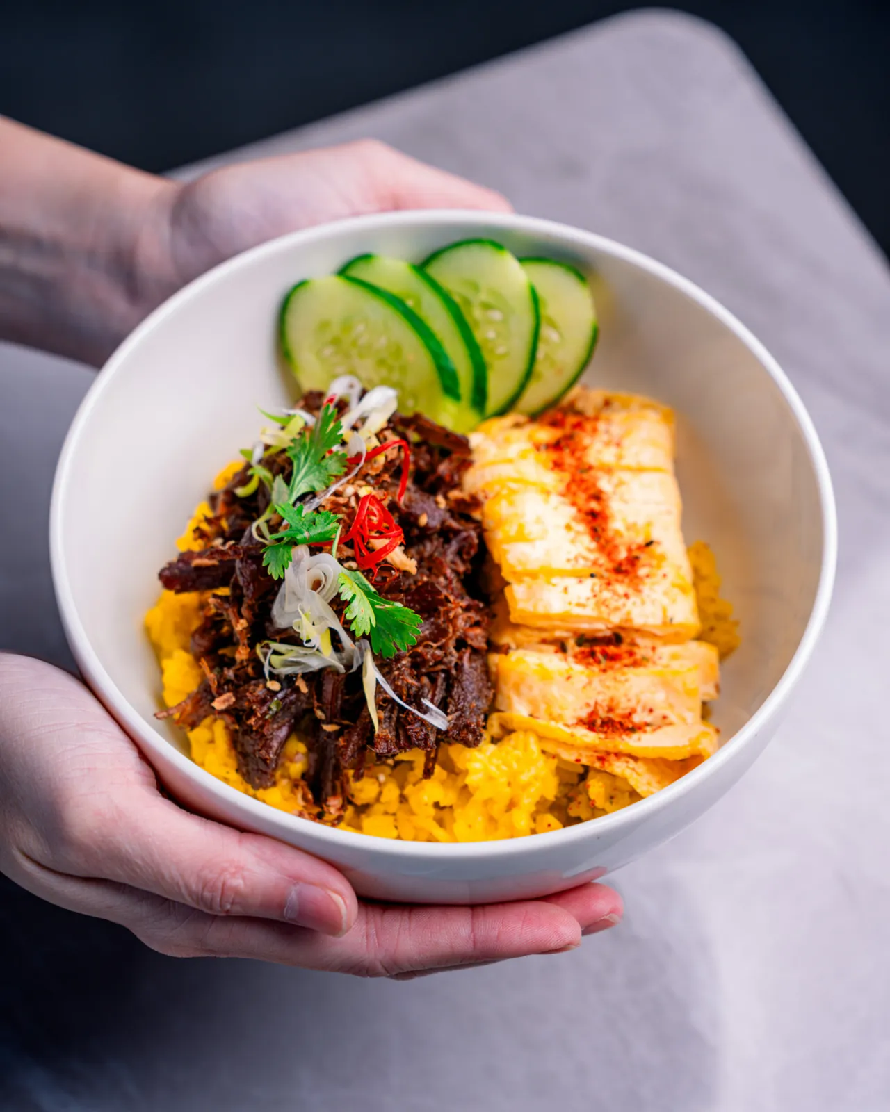 Empal gepuk bowl with cucumber and fried tofu